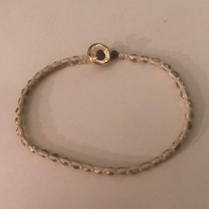 White Bracelet with Gold Accents